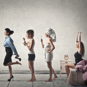 A sequence of a woman waking up in bed, getting out of the shower in a towel, putting on makeup, and walking out the door dressed for the office